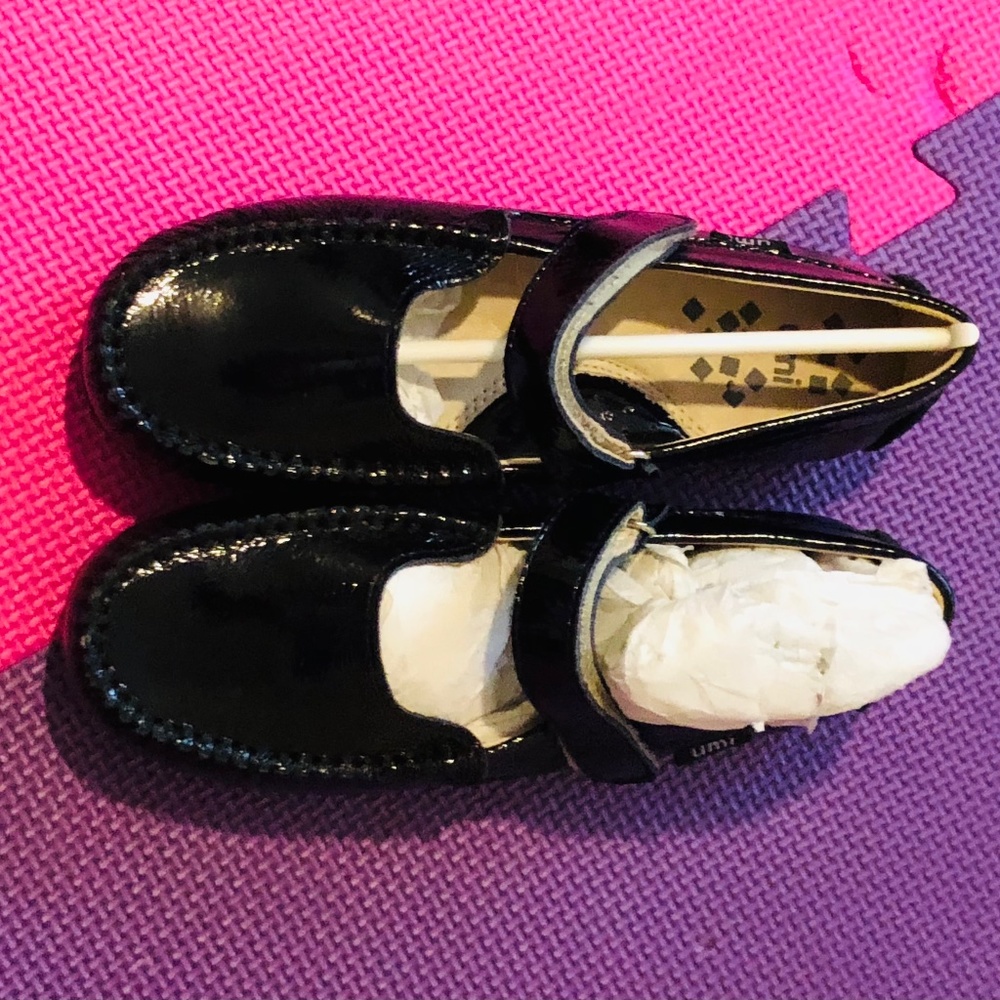 Black, patent leather, kids Mary Jane shoe.